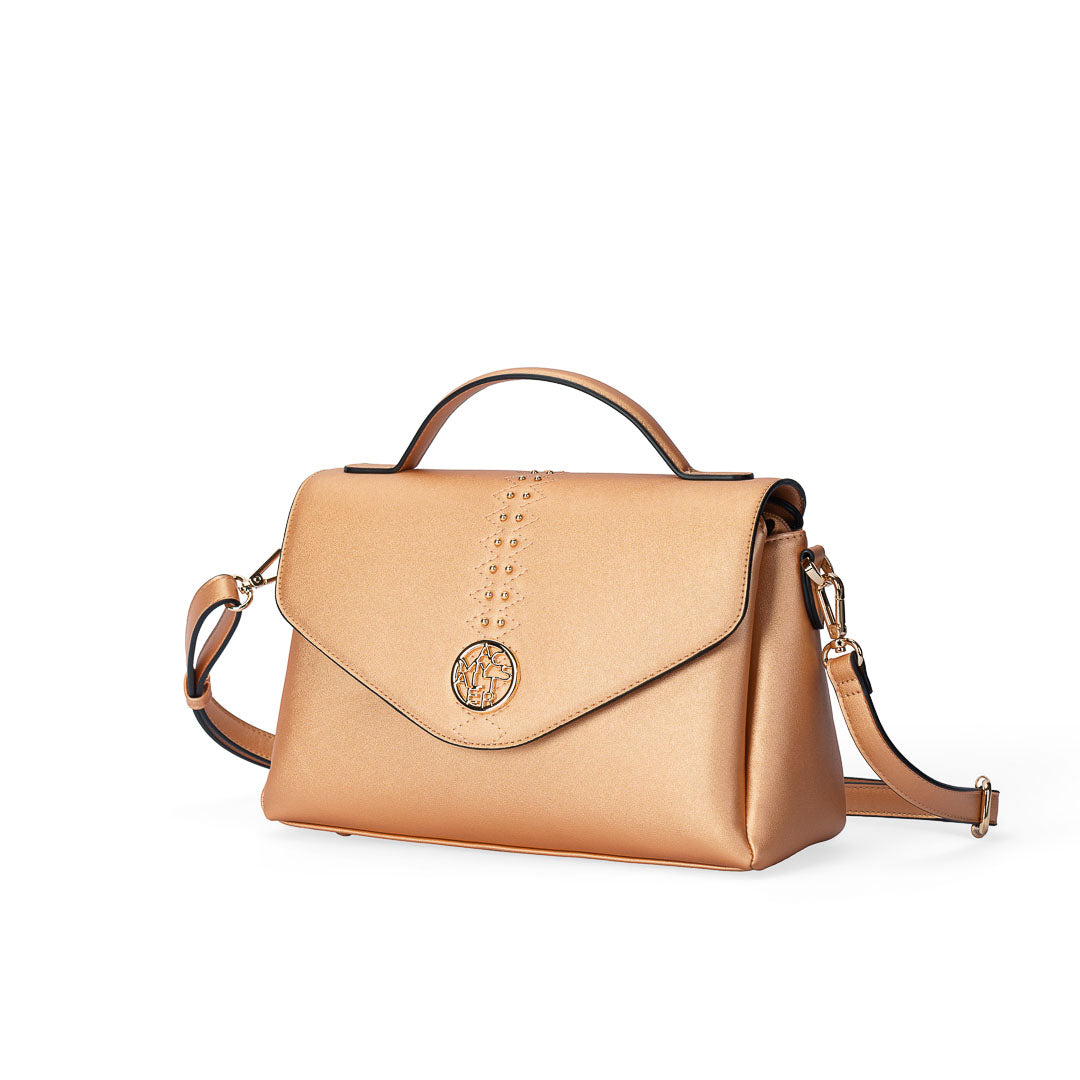 Sac à main TENTATION or rosé par Mac Alyster, vue de trois-quarts
